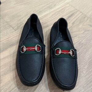 Brand new authentic Gucci Black Leather Loafers with Signature Stripe